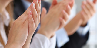 Clap Several hands of women and men clap.